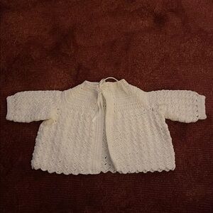 Crocheted baby sweater, white